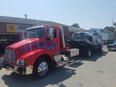 shop tow truck towing a truck